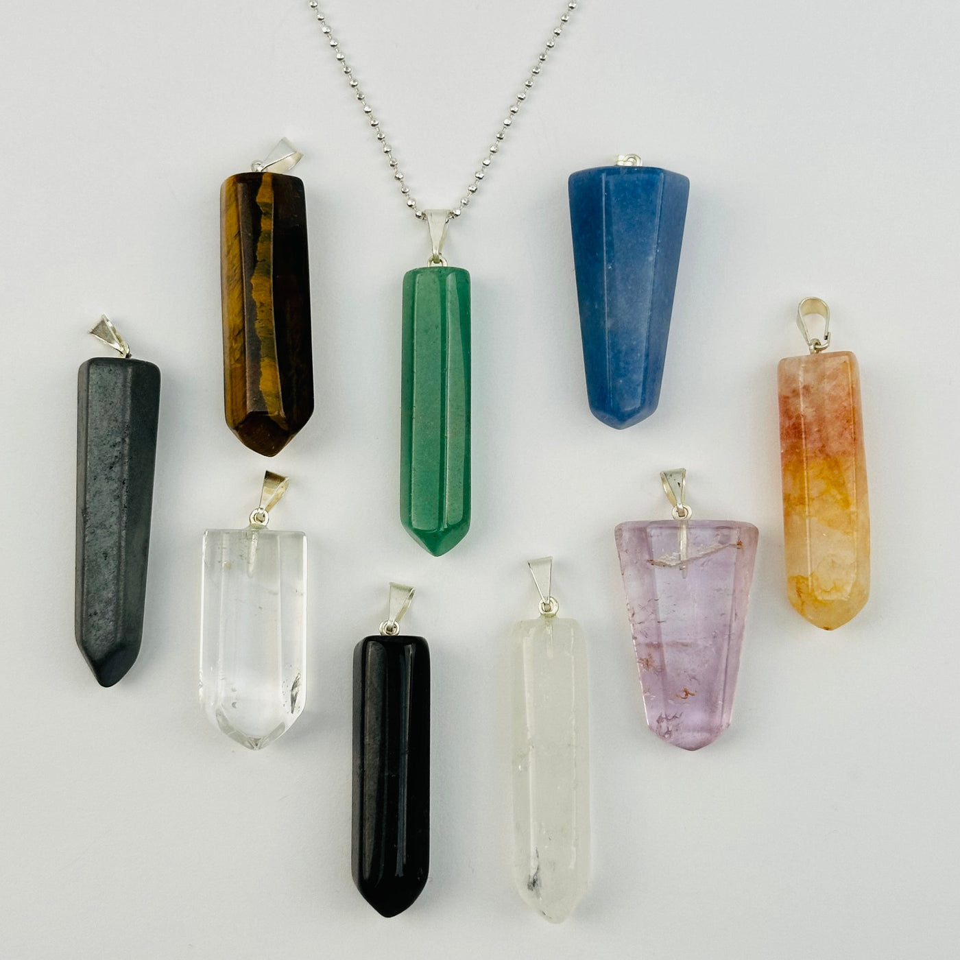 pendants displayed to show the differences in the crystal types and color shades 