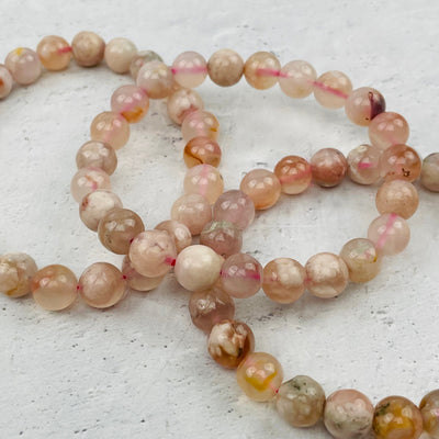 close up of the details on the flower agate bracelets 