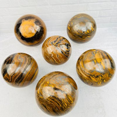 multiple spheres displayed to show the differences in the sizes and patterns 