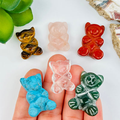Gemstone Crystal Bear Cabochons in hand for size reference 