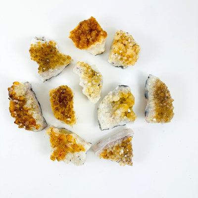Citrine Crystal Clusters on a table to show all