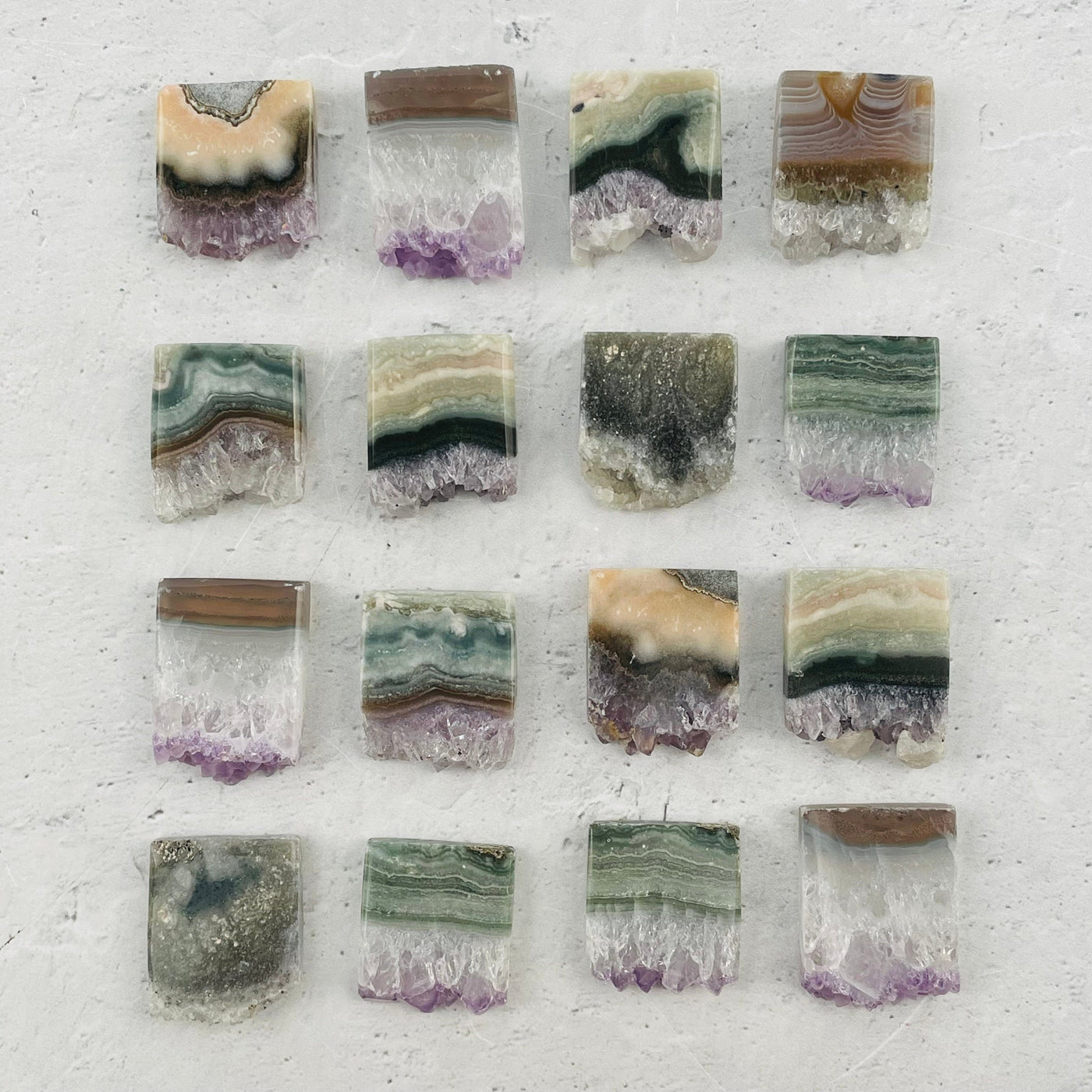 multiple amethyst slices displayed to show the differences in the color shades
