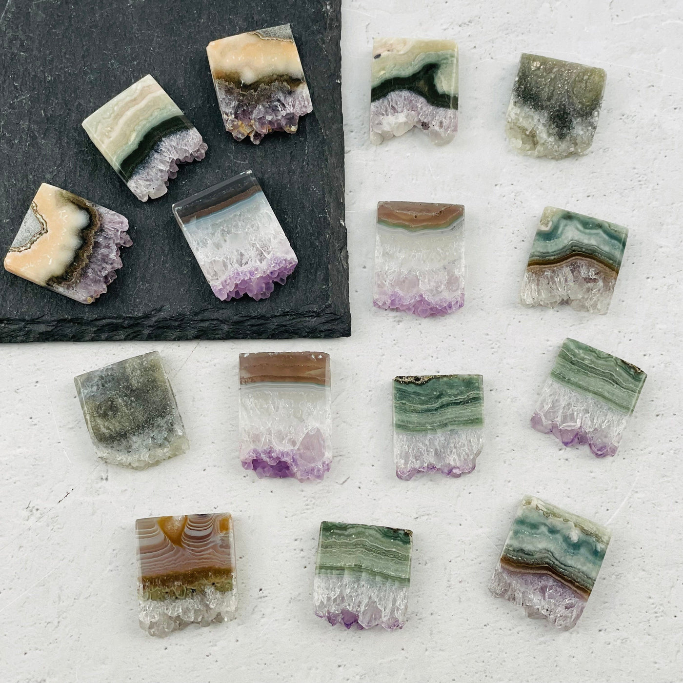 multiple amethyst slices displayed to show the differences in the color shades 
