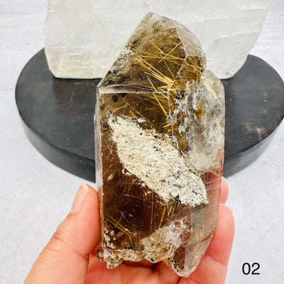 Natural Smoky Quartz Cluster with Rutilated inclusions. Option 02 in hand for size reference
