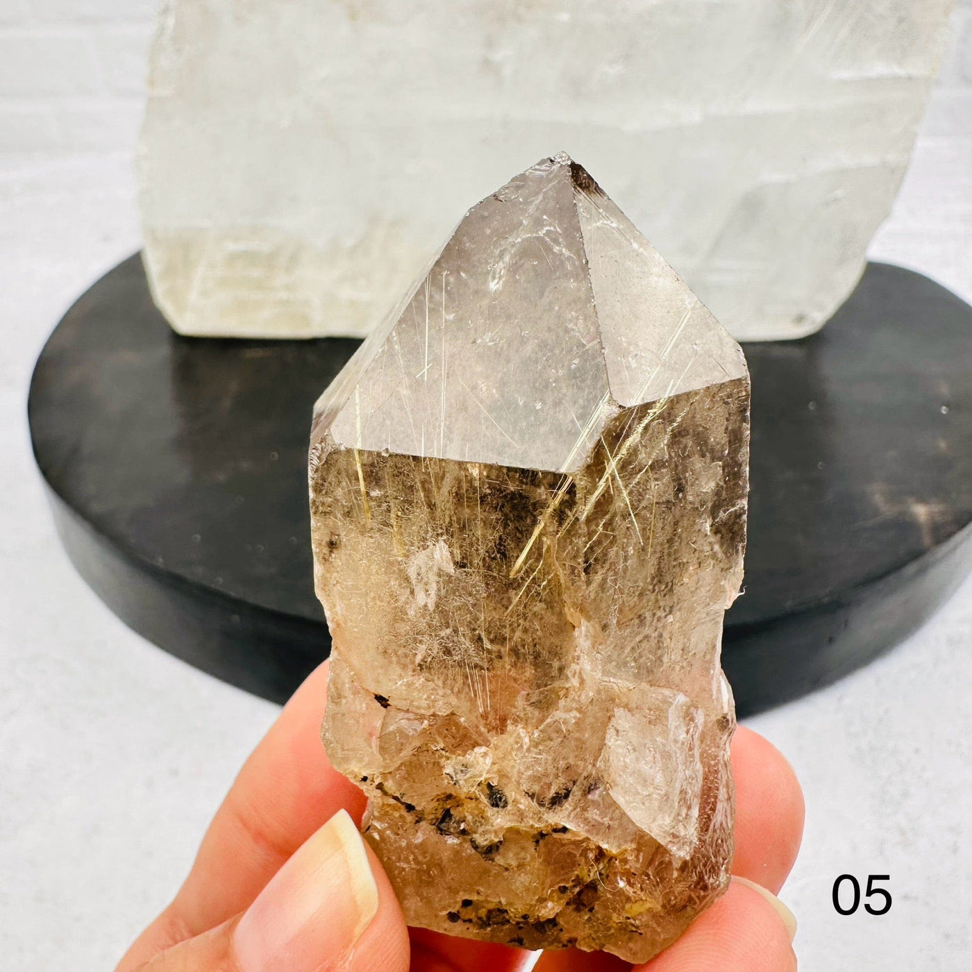 Natural Smoky Quartz Cluster with Rutilated inclusions. Option 05 in hand for size reference