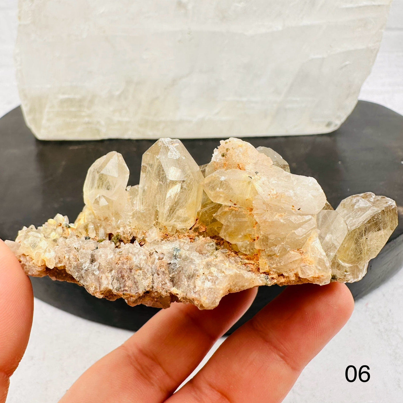 Natural Smoky Quartz Cluster with Rutilated inclusions. Option 06 in hand for size reference