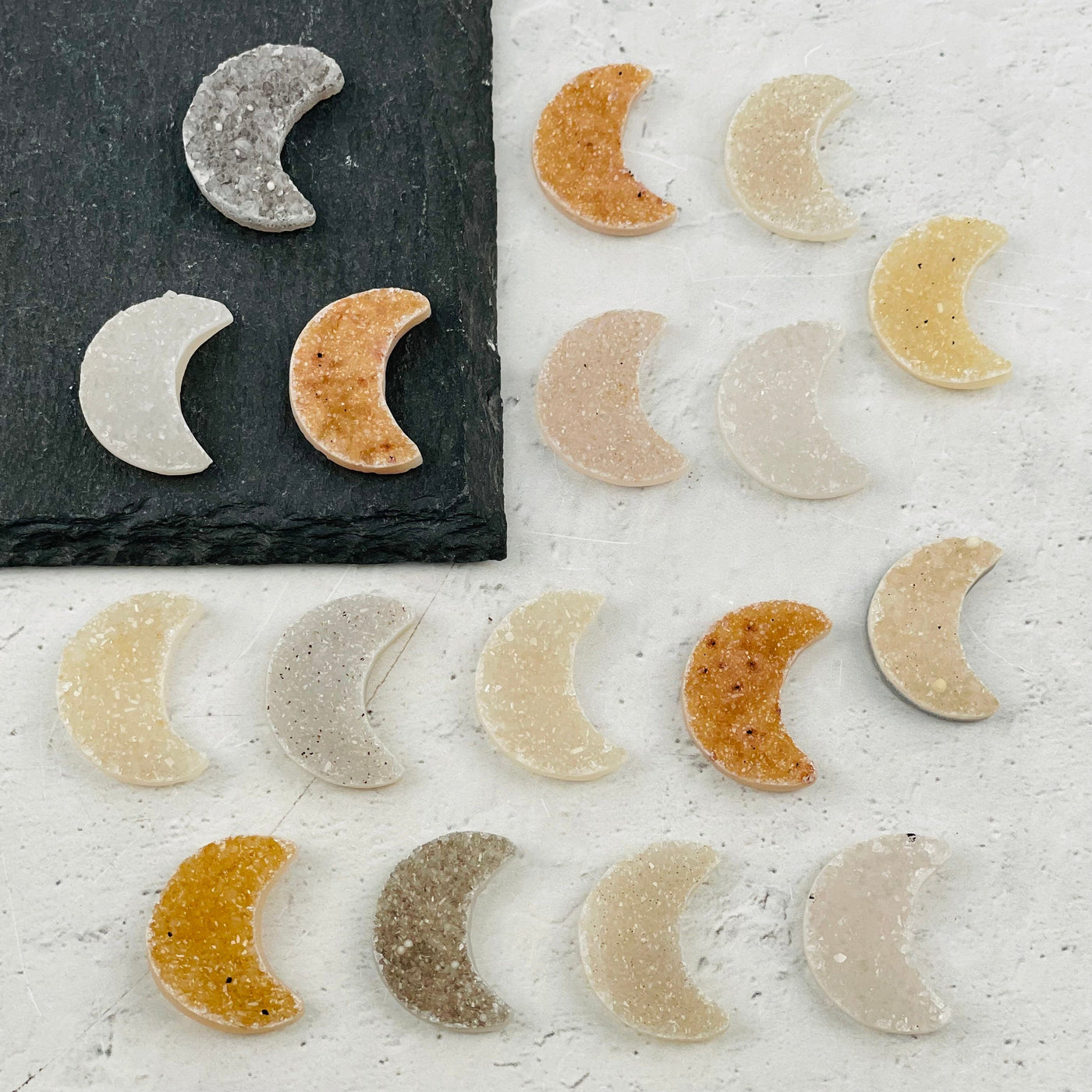 multiple druzy moons displayed to show the differences in the color shades 