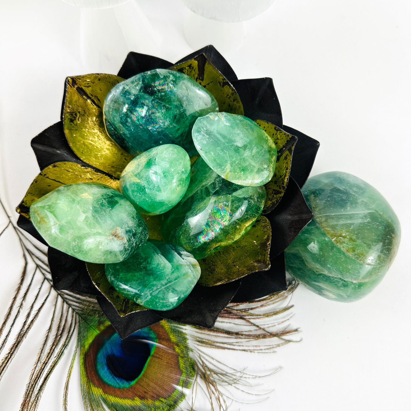Seven Fluorite Crystal Polished Stones on display in a bowl