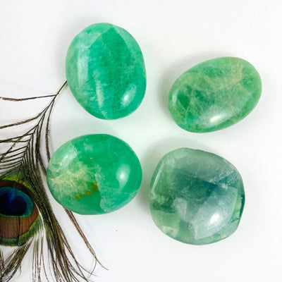 Fluorite Crystal Palm Stones on display