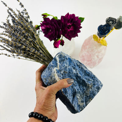 Natural Stone Vase made of sodalite in a hand for size reference