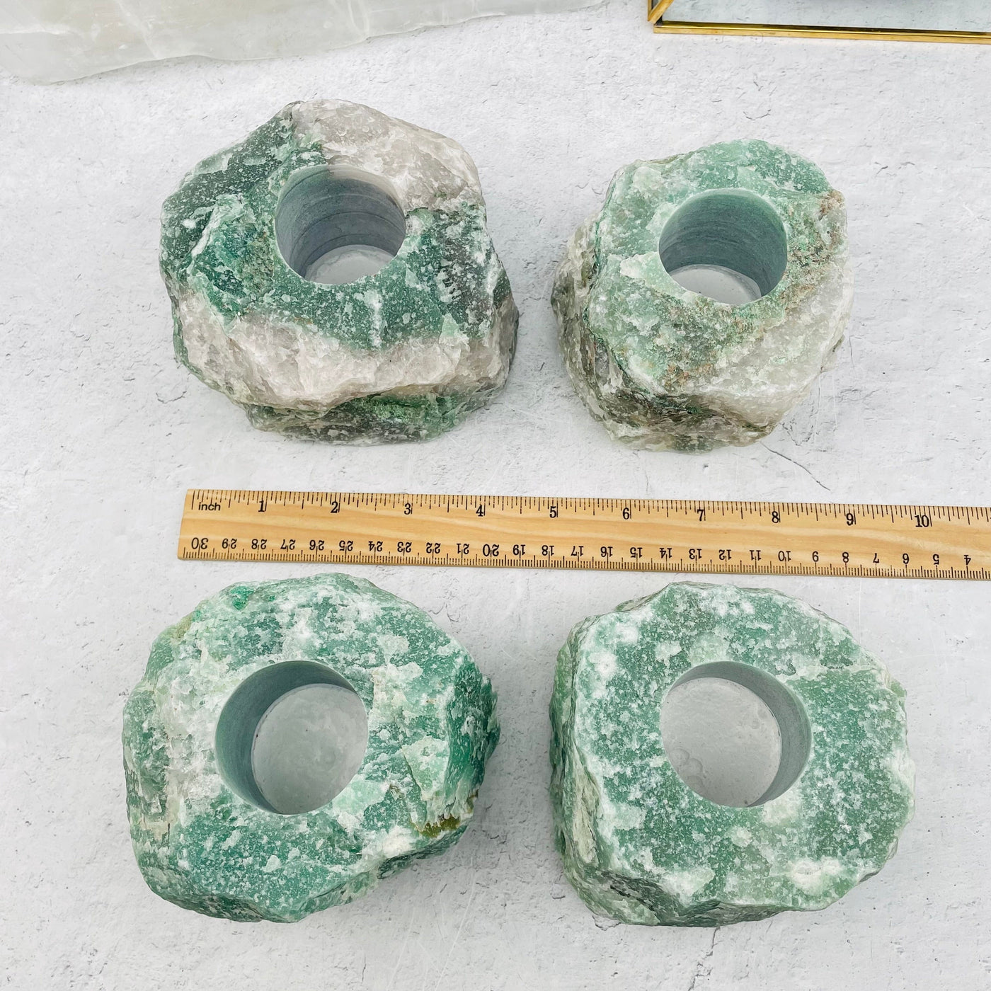 Green Quartz Candle Holders next to a ruler for size reference 