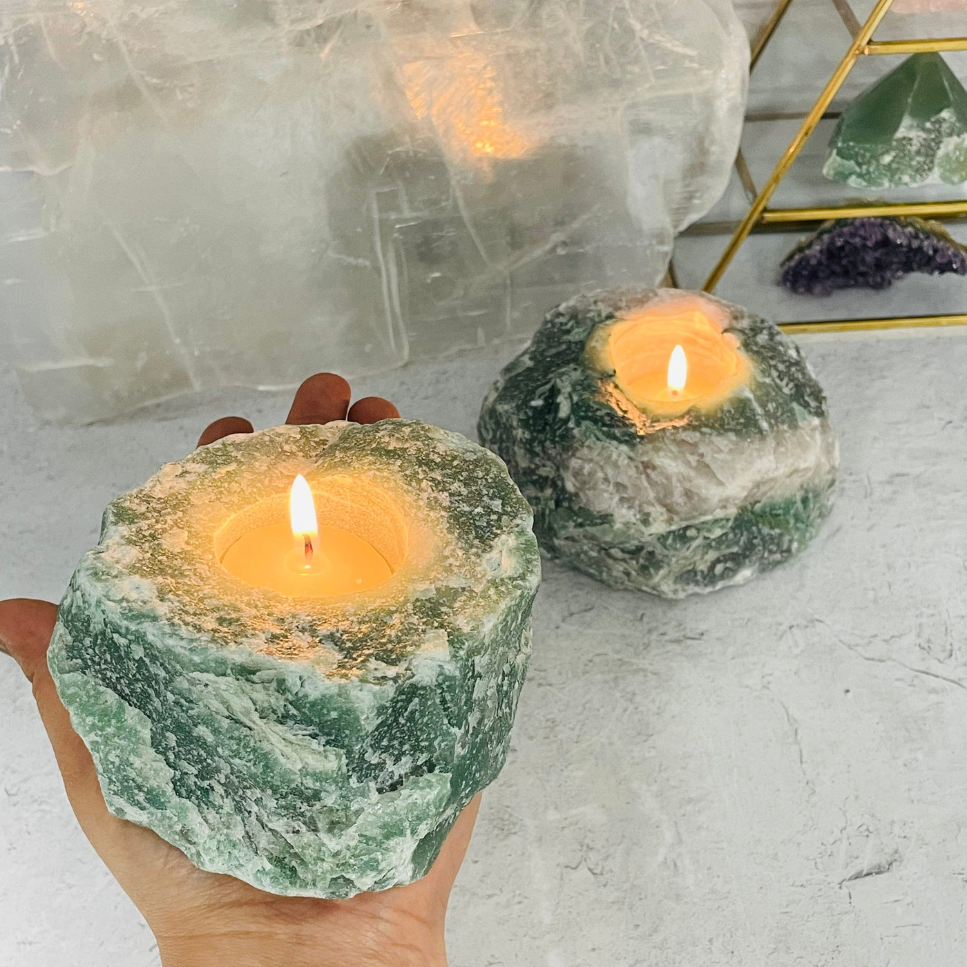 Green Quartz Candle Holder in hand for size reference 