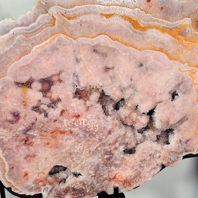 close up of the pink amethyst druzy crystals within the large cluster 
