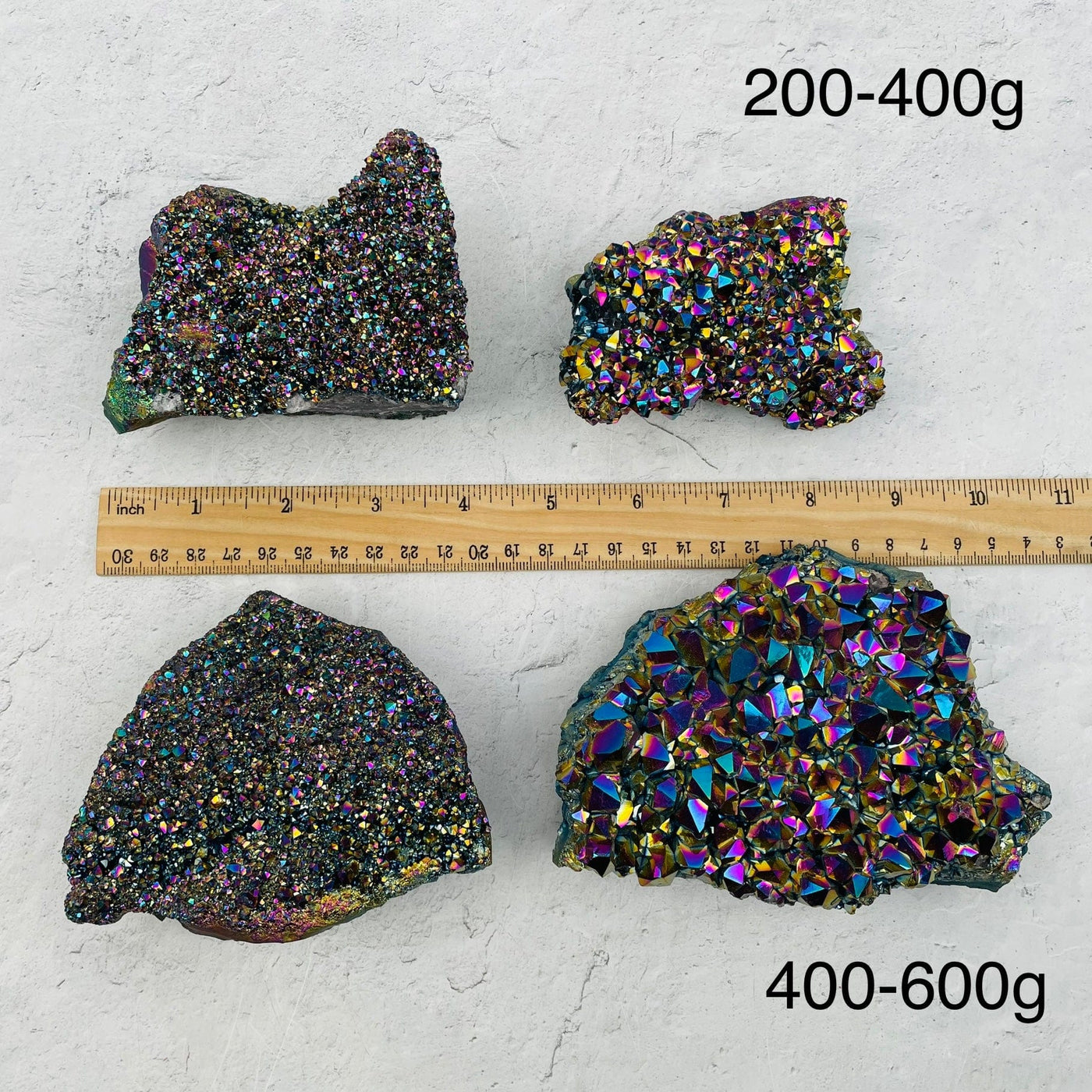 Amethyst Druzy Cluster with Rainbow Titanium Finish next to a ruler for size reference. sold by weight 