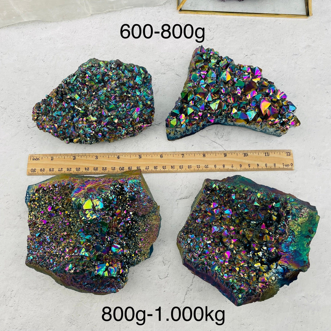 Amethyst Druzy Cluster with Rainbow Titanium Finish next to a ruler for size reference. sold by weight 