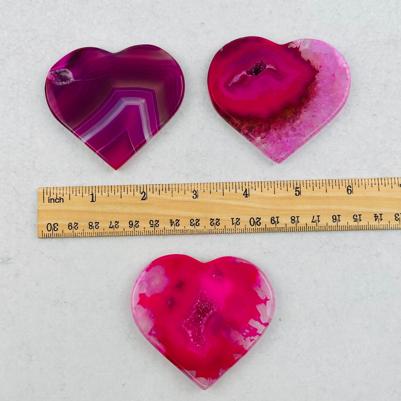 heart slices next to a ruler for size reference 