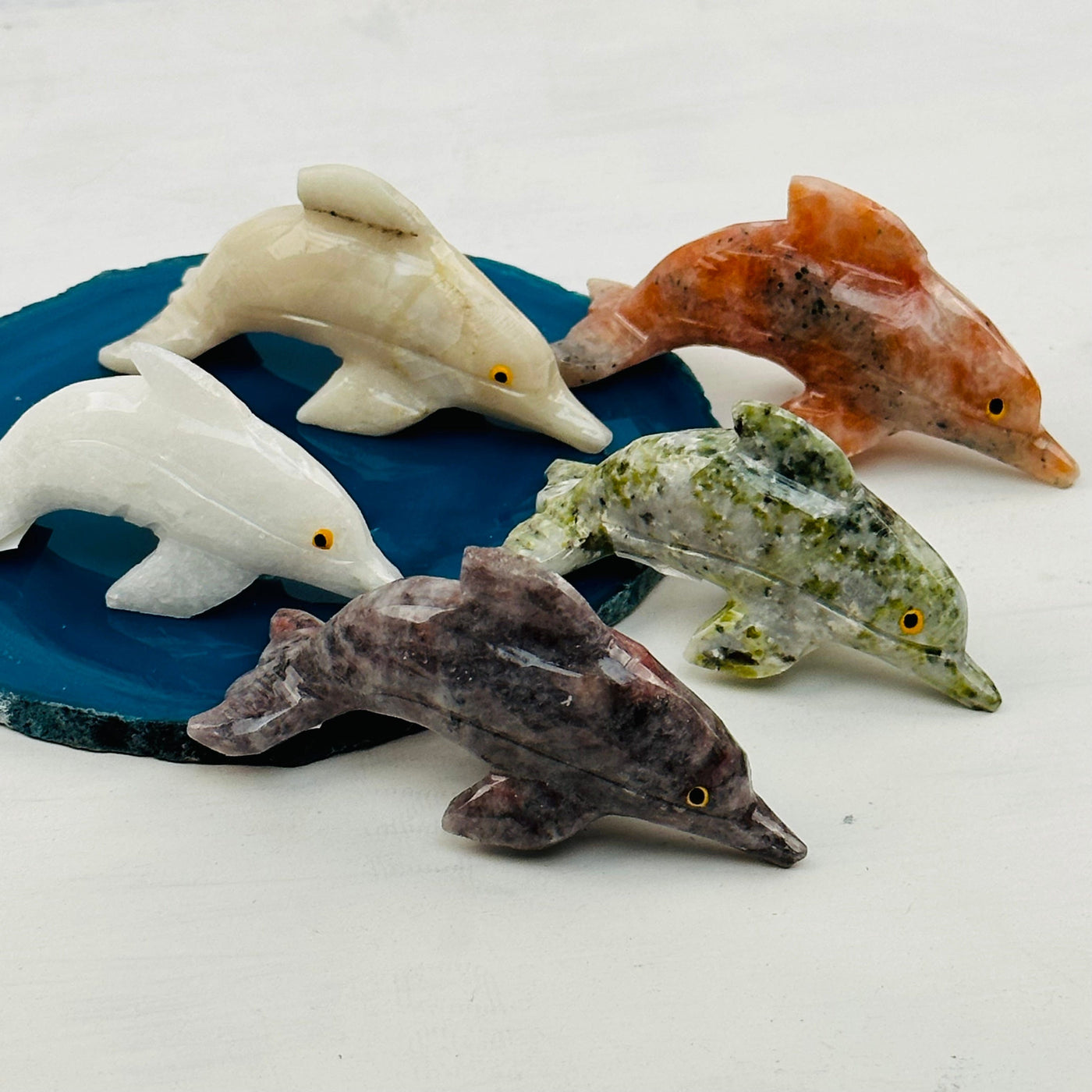 multiple dolphins displayed to show the differences in the crystal types 