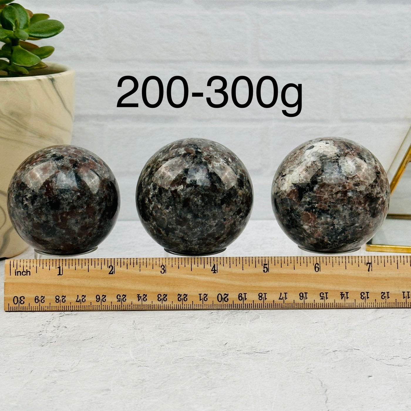 Yooperlite Spheres - By Weight - next to a ruler for size reference 