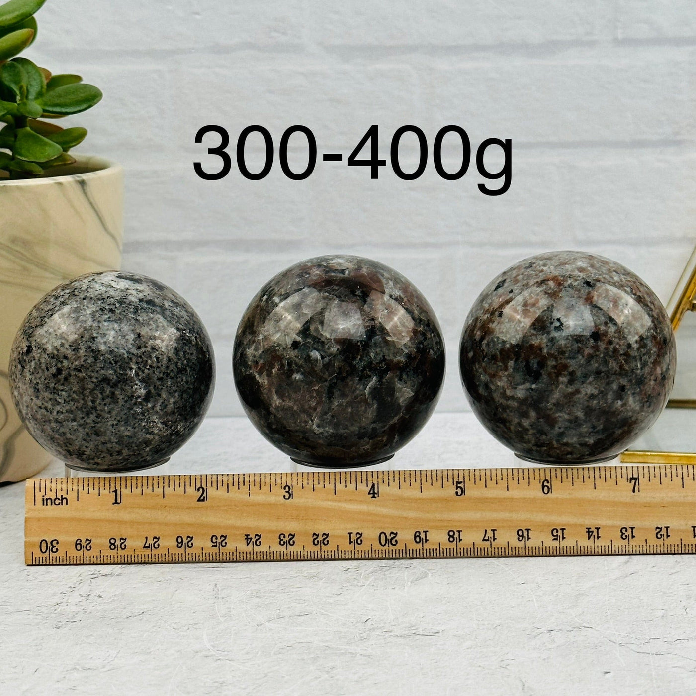 Yooperlite Spheres - By Weight - next to a ruler for size reference