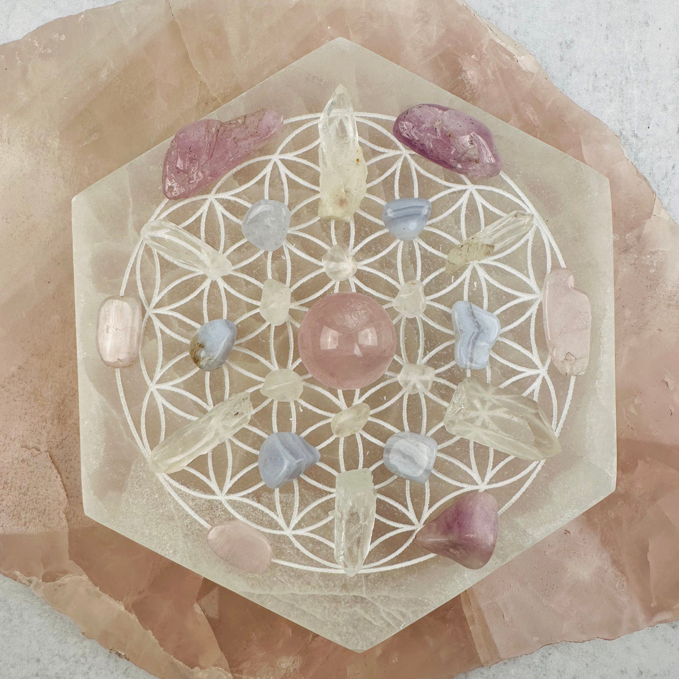 Selenite Hexagon Engraved with Flower of Life displayed as home decor 