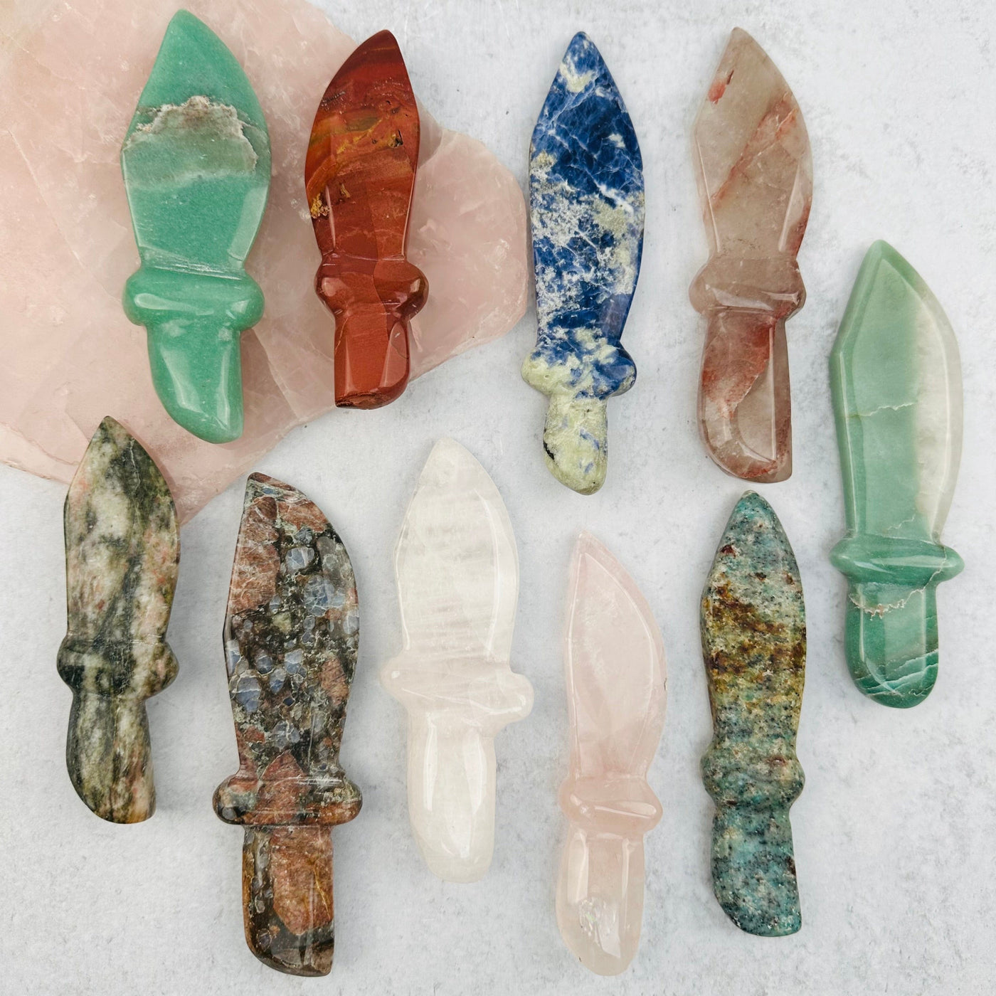 multiple gemstone knifes displayed to show the differences in the crystal type