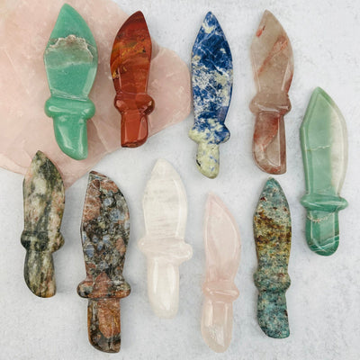 multiple gemstone knifes displayed to show the differences in the crystal type