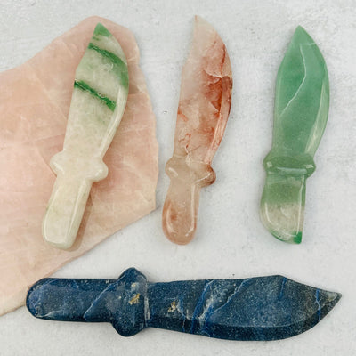 multiple crystal knives displayed to show the differences in the crystal types 