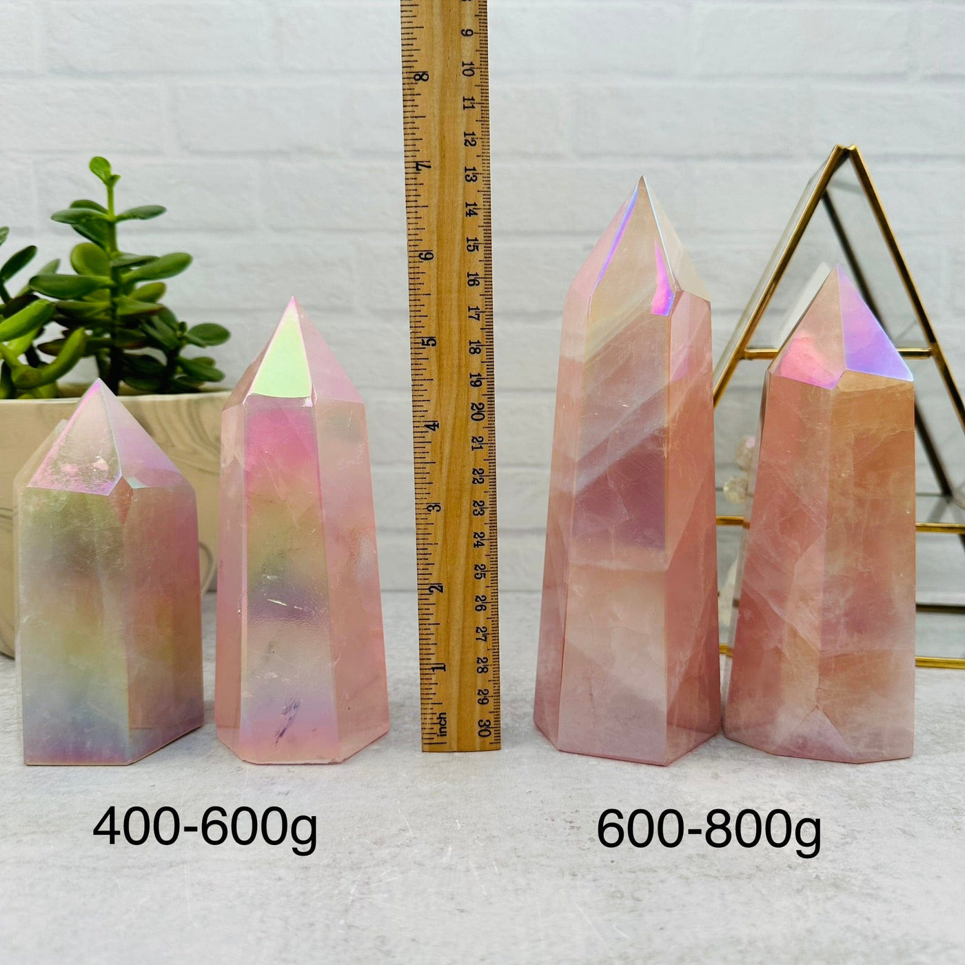 Angel Aura Rose Quartz Polished Tower - By Weight - next to a ruler for size reference 