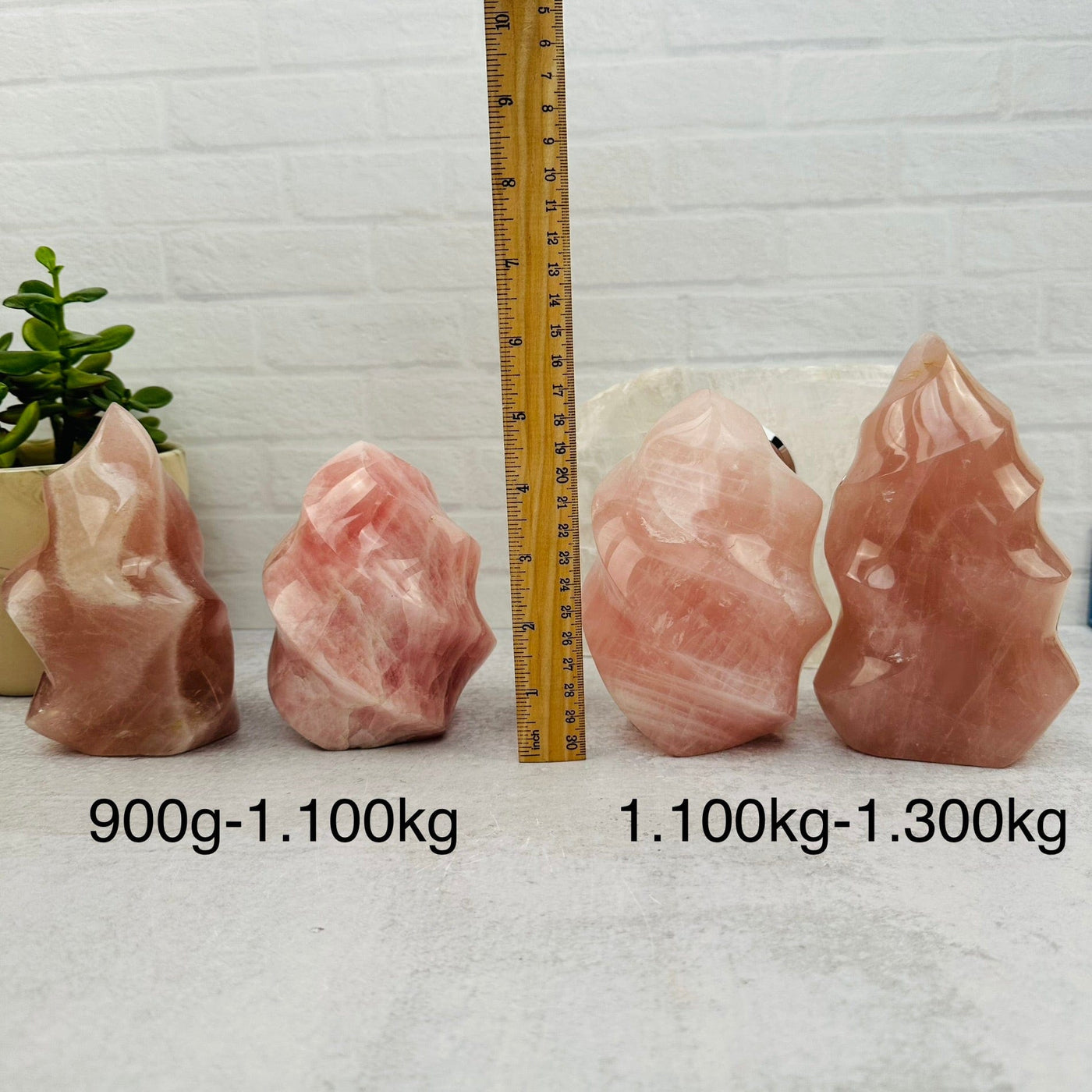 Rose Quartz Flame Tower - By Weight - next to a ruler for size reference