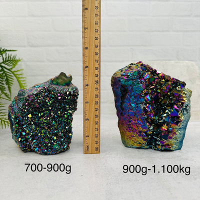 Amethyst Druzy Cutbase with Rainbow Titanium Finish sold by weight. next to a ruler for size reference