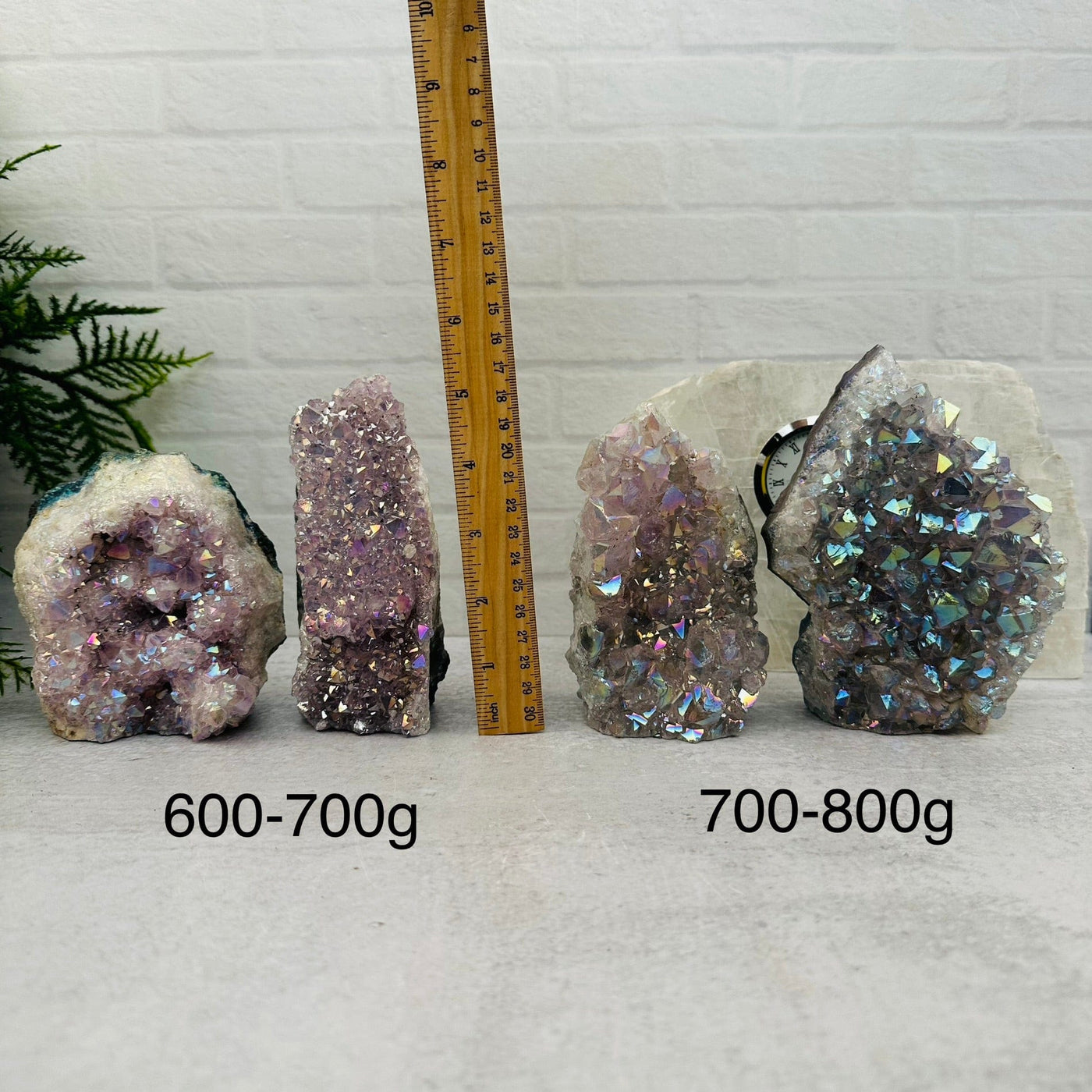 Amethyst Druzy Crystal Cut Base with Angel Aura by weight next to a ruler for size reference