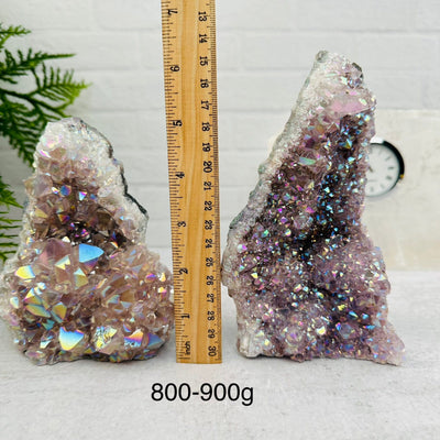 Amethyst Druzy Crystal Cut Base with Angel Aura by weight next to a ruler for size reference