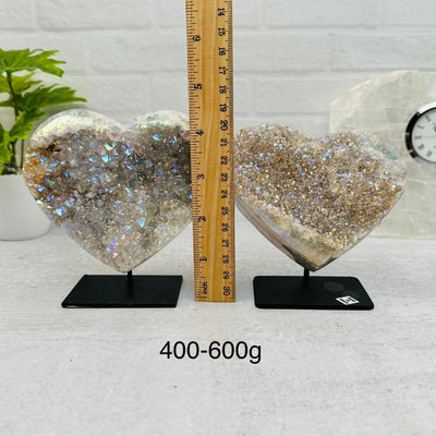 Amethyst Druzy Crystal Heart with Angel Aura on Metal Stand by weight. next to a ruler for size reference
