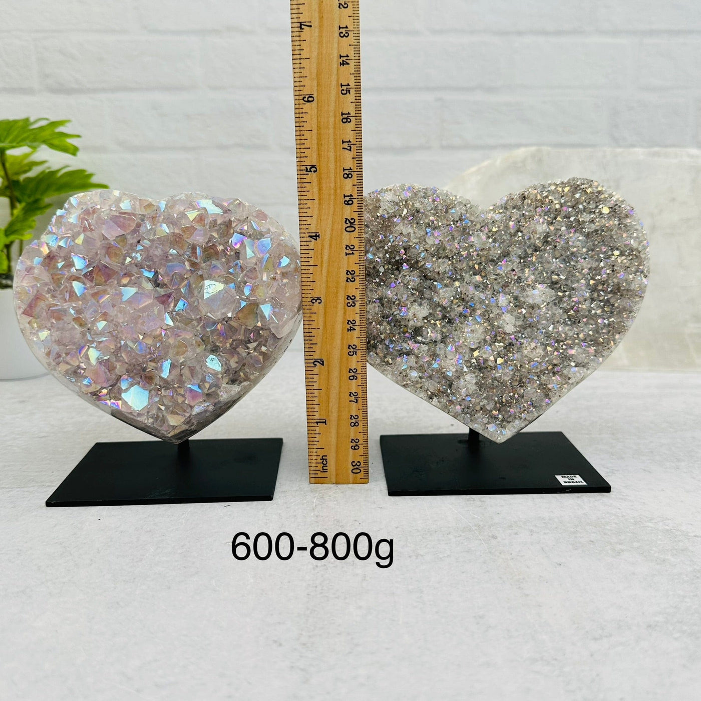 Amethyst Druzy Crystal Heart with Angel Aura on Metal Stand by weight. next to a ruler for size reference