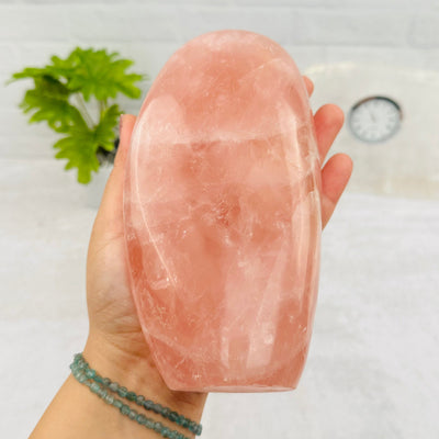 Rose Quartz Cut Base in hand for size reference 