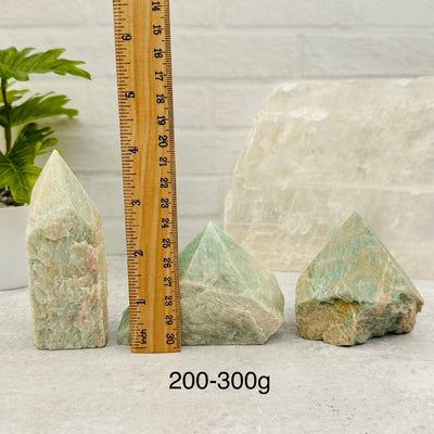 Amazonite Semi Polished Point - By Weight - next to a ruler for size reference