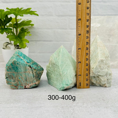Amazonite Semi Polished Point - By Weight - next to a ruler for size reference