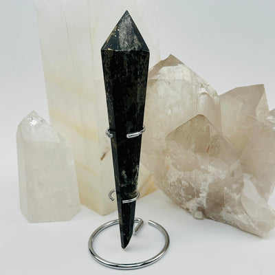 pyrite crystal wand on metal stand displayed as home decor