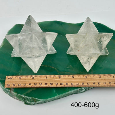 crystal quartz Merkabah stars displayed next to a ruler for size reference 