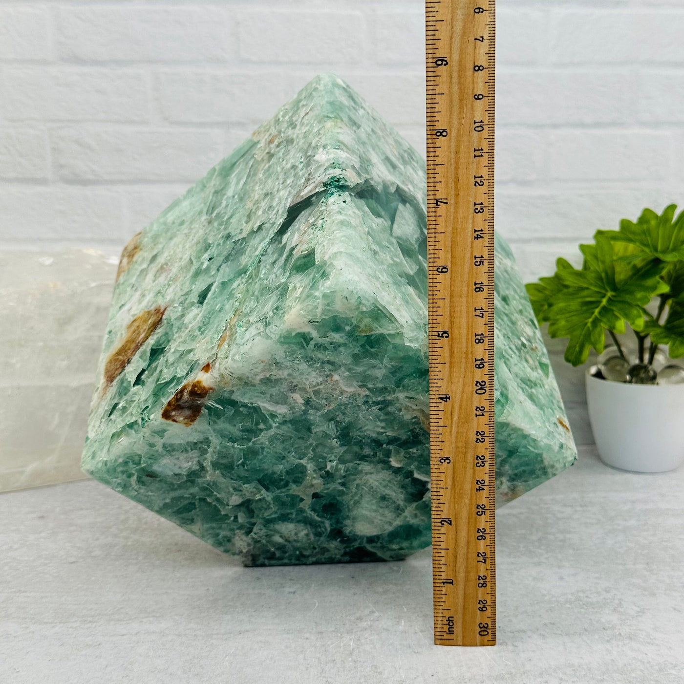fluorite cube next to a ruler for size reference 