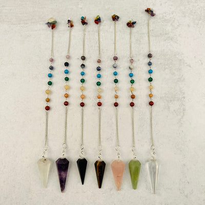 Crystal Pendulums on Chakra Chain displayed to show the differences in the crystal types 