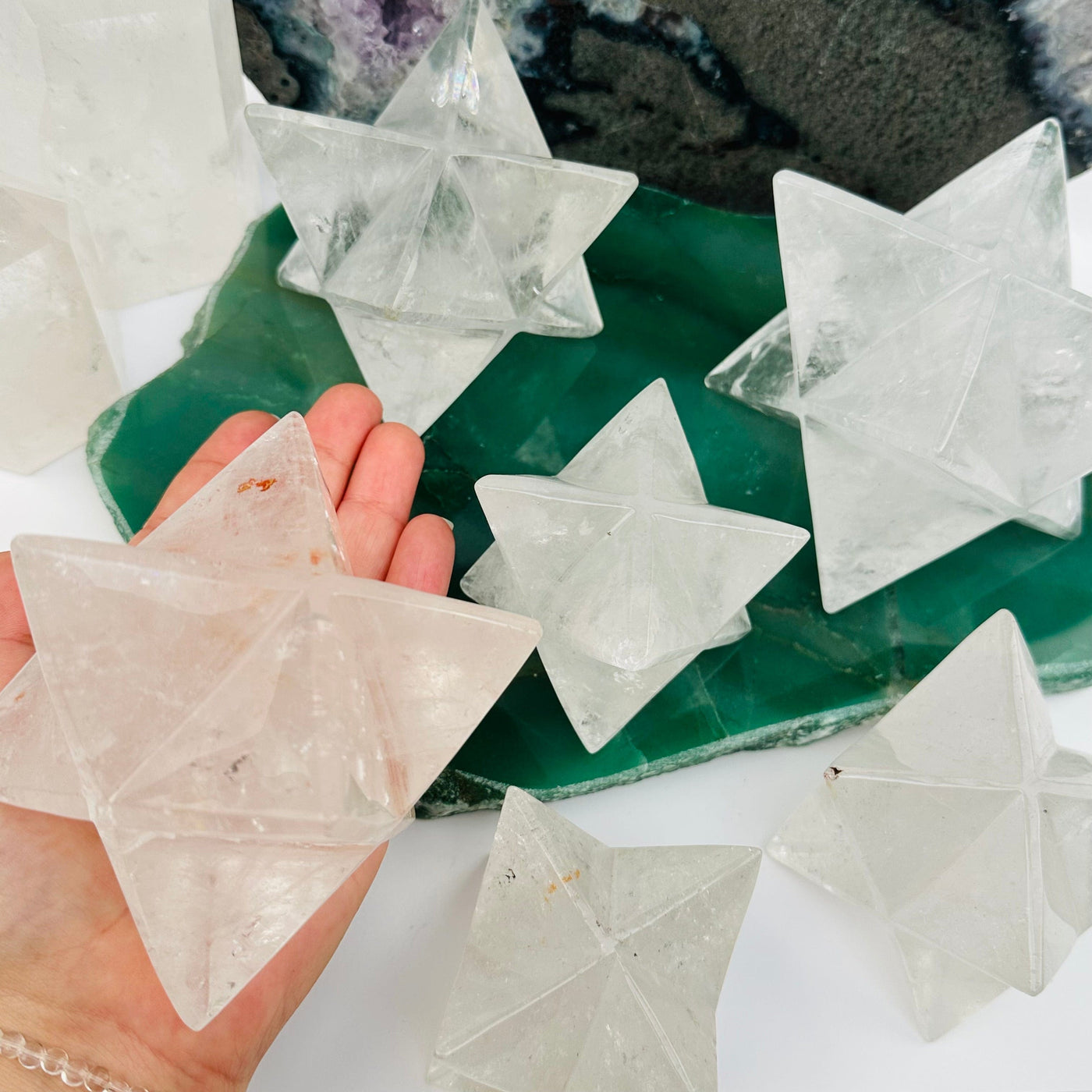 crystal quartz Merkabah star in hand for size reference 