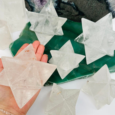 crystal quartz Merkabah star in hand for size reference 
