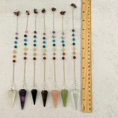 Crystal Pendulum on Chakra Chain next to a ruler for size reference 