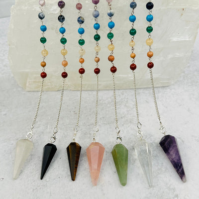 Crystal Pendulums on Chakra Chain displayed to show the differences in the crystal types