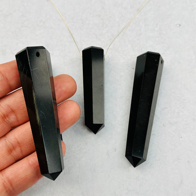 Large Black Onyx Tower Thin Obelisk Point - DRILLED in hand for size reference 