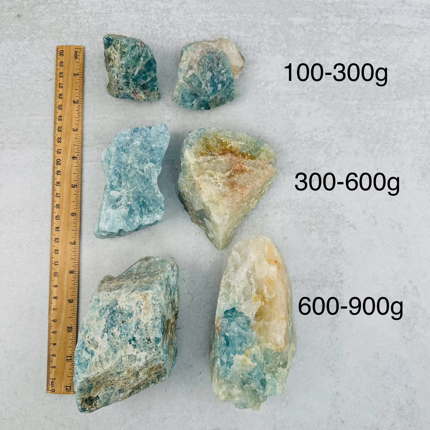 Rough Aquamarine - By Weight - next to a ruler for size reference 