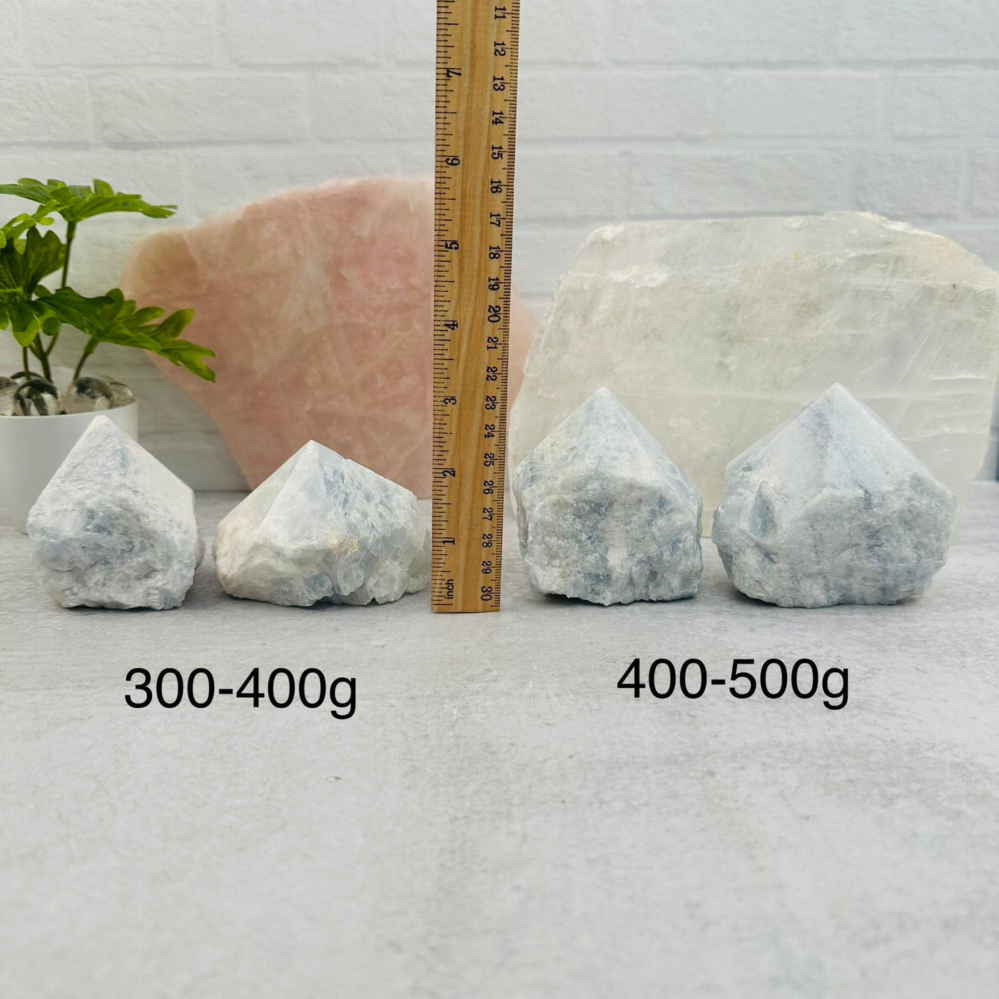 Blue Calcite Semi-Polished Points - By Weight next to a ruler for size reference 
