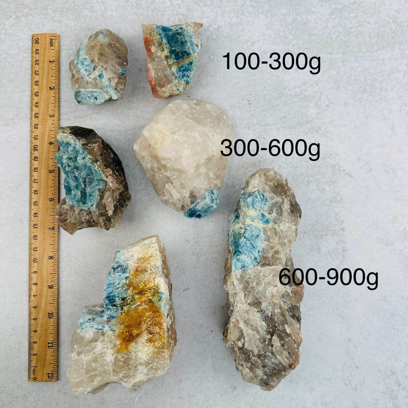 Rough Aquamarine on Matrix - By Weight - next to a ruler for size reference 