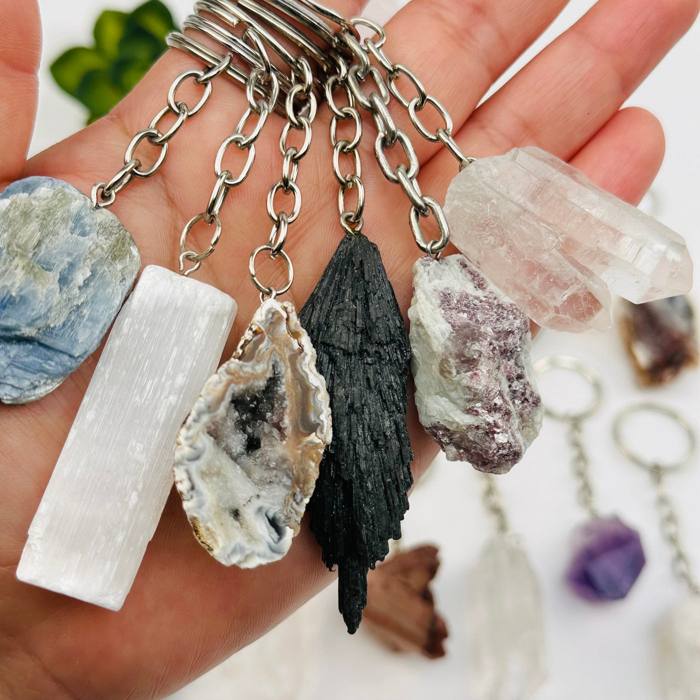 close up of the details on these rough stone key chains 